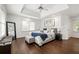 Large main bedroom with tray ceiling, hardwood floors, and large windows at 1558 Grant Ne Dr, Atlanta, GA 30319