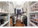 Organized walk-in closet with custom shelving, hanging rods, and clear storage bins at 1558 Grant Ne Dr, Atlanta, GA 30319