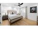 Relaxing bedroom showcasing a bed with upholstered frame, ceiling fan, and natural light at 2231 Fairoaks Rd, Decatur, GA 30033