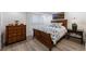 Bedroom featuring hardwood flooring, a wooden bed frame, and a matching dresser at 2231 Fairoaks Rd, Decatur, GA 30033