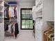 Organized walk-in closet with custom shelving, a window for natural light, and ample hanging space at 2231 Fairoaks Rd, Decatur, GA 30033