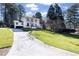 Traditional-style home with an expansive front lawn and long driveway at 2231 Fairoaks Rd, Decatur, GA 30033