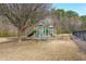 Community playground with slides, climbing structures, and a picnic table for Gathering fun at 4972 Arbor View Nw Pkwy, Acworth, GA 30101