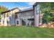 View of the backyard featuring a wooden deck and stairs leading to a well-maintained lawn at 772 Crescent Cir, Canton, GA 30115