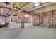 Spacious unfinished basement with exposed ceiling and framing, providing a blank canvas for future renovations at 772 Crescent Cir, Canton, GA 30115