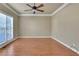 Bright and airy room with hardwood flooring, a fan, and generous natural light at 772 Crescent Cir, Canton, GA 30115