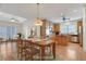 A dining room with a table set, connected to the kitchen and living room at 772 Crescent Cir, Canton, GA 30115