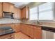 Kitchen featuring stainless steel appliances, granite countertops, and tiled backsplash at 772 Crescent Cir, Canton, GA 30115