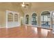 Bright living room featuring hardwood floors, a built-in bookcase and access to screened-in porch at 772 Crescent Cir, Canton, GA 30115