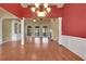 Spacious room featuring hardwood flooring and elegant trim, creating a welcoming atmosphere at 772 Crescent Cir, Canton, GA 30115