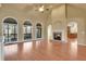 Bright living room featuring hardwood floors, a fireplace, and a view into the kitchen at 772 Crescent Cir, Canton, GA 30115