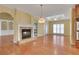 Spacious living room with hardwood floors, fireplace, and natural light at 772 Crescent Cir, Canton, GA 30115