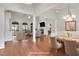 Staged living and dining room with hardwood floors and columns in an open concept plan at 772 Crescent Cir, Canton, GA 30115