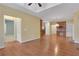 Open floorplan living room with hardwood floors flowing into the kitchen and hallways at 772 Crescent Cir, Canton, GA 30115