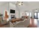 Open-concept living room featuring hardwood floors, fireplace and ample natural light at 772 Crescent Cir, Canton, GA 30115