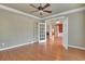 Bright home office space with hardwood floors and open doors to a dining room and living room at 772 Crescent Cir, Canton, GA 30115