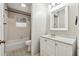 Well-lit bathroom with a tub, updated vanity, and stylish fixtures at 4072 Whispering Forest Ct, Lilburn, GA 30047