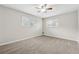 Empty bedroom with neutral carpeting and natural light, offering a blank canvas for personalization at 4072 Whispering Forest Ct, Lilburn, GA 30047