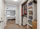 Organized walk-in closet with shelves and racks, providing ample storage space and bedroom access at 4072 Whispering Forest Ct, Lilburn, GA 30047