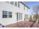 Backyard featuring a wood deck with railings, windows, and white siding at 4669 Prater Se Way, Smyrna, GA 30080