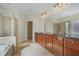 Beautiful bathroom featuring a double sink vanity with granite countertops at 4669 Prater Se Way, Smyrna, GA 30080