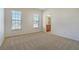 Neutral bedroom with carpet, two windows, and ensuite access at 4669 Prater Se Way, Smyrna, GA 30080