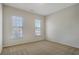 Bright bedroom features neutral carpet, fresh paint and two windows for natural light at 4669 Prater Se Way, Smyrna, GA 30080