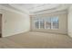 Spacious bedroom with tray ceiling and three large windows at 4669 Prater Se Way, Smyrna, GA 30080