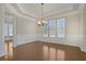 Bright dining room with hardwood floors, coffered ceilings, and wainscoting detail at 4669 Prater Se Way, Smyrna, GA 30080