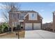 Charming two-story brick home featuring an attached two-car garage and manicured landscaping at 4669 Prater Se Way, Smyrna, GA 30080