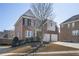 Two story brick home with a two car garage and manicured front yard at 4669 Prater Se Way, Smyrna, GA 30080