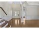 Bright and open foyer with hardwood floors, columns, and elegant staircase at 4669 Prater Se Way, Smyrna, GA 30080