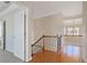 Bright hallway with hardwood floors, iron railing, and chandelier view at 4669 Prater Se Way, Smyrna, GA 30080