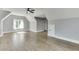 This is a large bonus room with great ceiling height, wood floors, and natural light at 5975 P W A Dr, Cumming, GA 30041