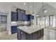 Contemporary kitchen with blue cabinets, an island with granite countertops, and stainless steel appliances at 5975 P W A Dr, Cumming, GA 30041