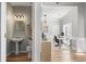 Well-lit bathroom showcases a pedestal sink, toilet, and decorative mirror at 4525 Chelton Se Ct, Smyrna, GA 30080