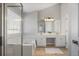 Bright bathroom features double sink, mirror and bathtub next to glass-enclosed shower at 4525 Chelton Se Ct, Smyrna, GA 30080
