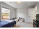 Bedroom featuring a large window that provides natural light and a view to the back yard at 4525 Chelton Se Ct, Smyrna, GA 30080