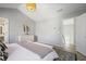 Grey bedroom with a queen bed, white dresser, and hallway leading to stairway at 4525 Chelton Se Ct, Smyrna, GA 30080