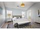 Comfortable bedroom with vaulted ceiling, two windows and hardwood floor at 4525 Chelton Se Ct, Smyrna, GA 30080