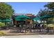 Starbucks store featuring a modern design with outdoor seating, umbrellas and blue skies at 4525 Chelton Se Ct, Smyrna, GA 30080