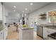 Open-concept kitchen with a kitchen island, stainless steel appliances, and hardwood floors at 4525 Chelton Se Ct, Smyrna, GA 30080