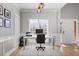 Home office with natural light from the windows, hardwood floor and white trim at 4525 Chelton Se Ct, Smyrna, GA 30080
