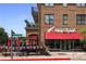 Charming McCray's Tavern restaurant front with brick facade and eye-catching red awning at 4525 Chelton Se Ct, Smyrna, GA 30080
