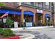 Charming Hook Line & Schooner restaurant front with a brick facade and eye-catching blue awnings at 4525 Chelton Se Ct, Smyrna, GA 30080