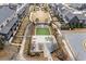 Aerial view of community common with lawns, sidewalks, landscaping and picnic tables at 6785 Pippin Walk, Alpharetta, GA 30005