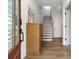 Bright entryway with hardwood floors, leading to a staircase and other rooms in the house at 6785 Pippin Walk, Alpharetta, GA 30005