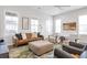 Bright and airy living room with a sofa, stylish chairs, and lots of natural light at 6785 Pippin Walk, Alpharetta, GA 30005