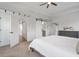 An open Primary bedroom with a barn door to the bathroom and open doors to other rooms provides convenient access at 6785 Pippin Walk, Alpharetta, GA 30005