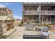 Inviting brick patio with stone fireplace and ample seating for outdoor gatherings at 6785 Pippin Walk, Alpharetta, GA 30005
